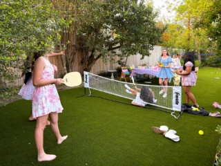 What a fun backyard! 😀 No more muddy mess. Clean and green all year long.