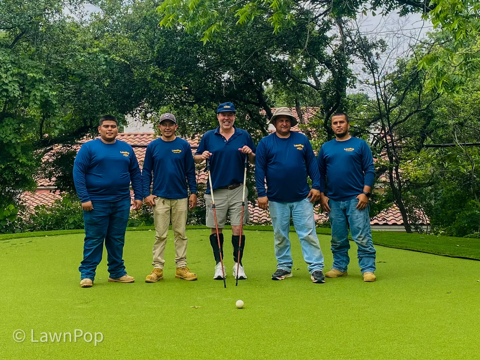 LawnPop's in-house putting green installation team on a finished green in Austin