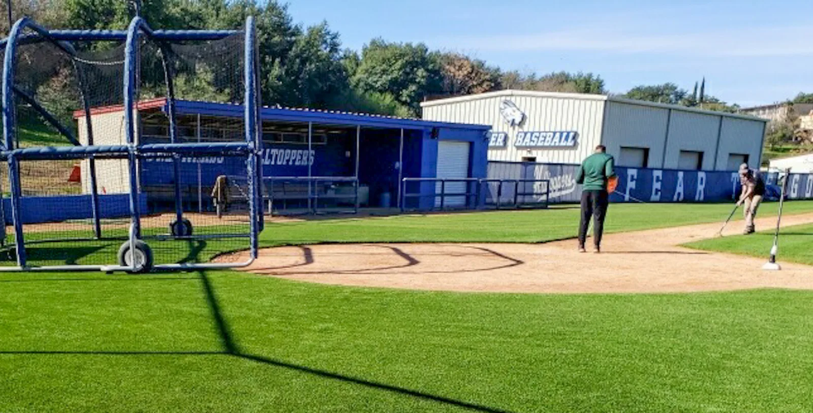Backstop and batting area on artificial sports turf