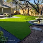 Austin home with a lush artificial grass lawn that stays green all year