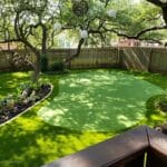 Backyard golfer testing new artificial putting green installed by LawnPop